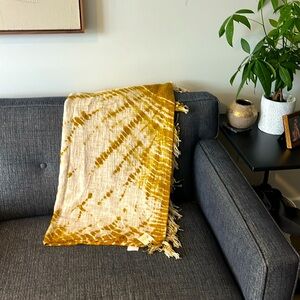 Brand new, never used mustard tie-dye tasseled throw blanket.